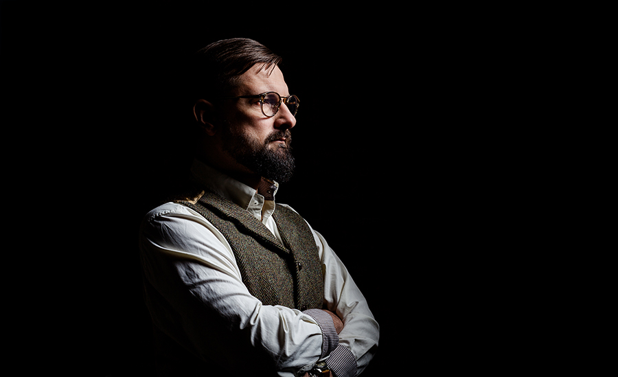 Brilliant portrait photographer in Warsaw. Miłosz Brzeziński, portrait photo session for book promotion.