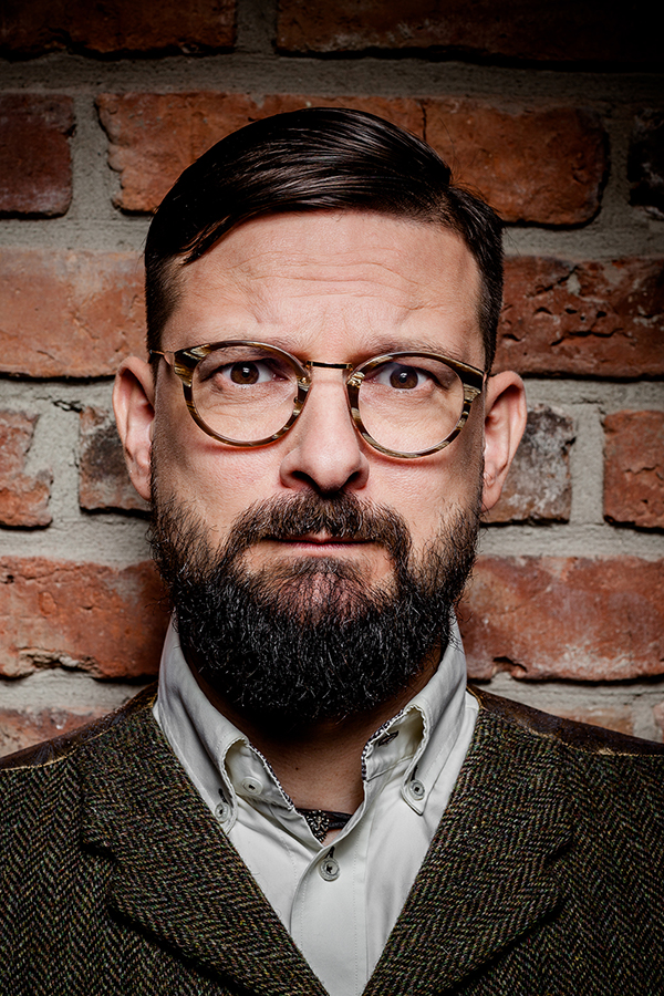 Outstanding portrait photographer in Warsaw. Miłosz Brzeziński, portrait photo session for book promotion